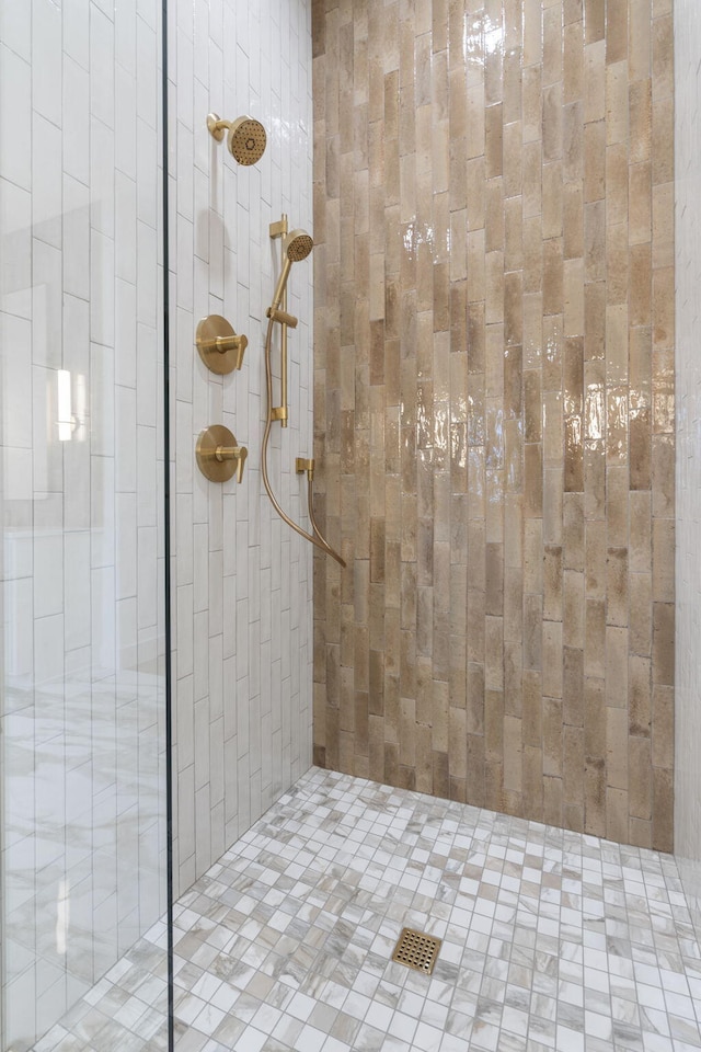 full bath featuring tiled shower