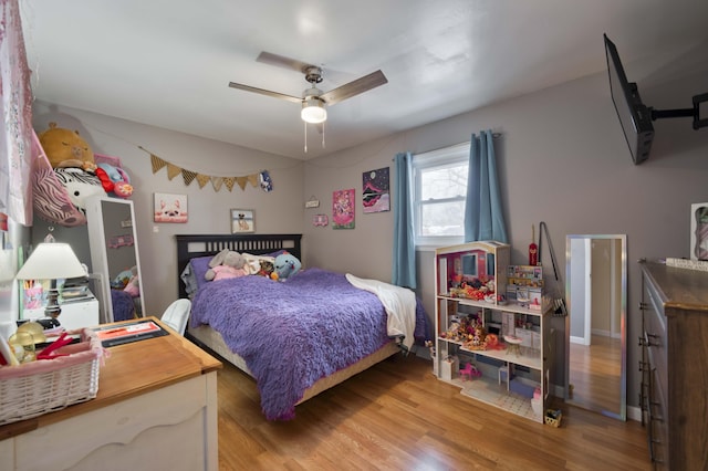 bedroom featuring ceiling fan and wood finished floors