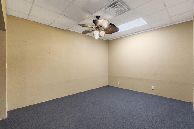 carpeted spare room with ceiling fan, a paneled ceiling, and visible vents