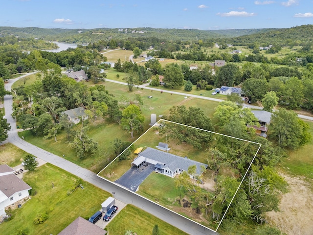 birds eye view of property with a residential view