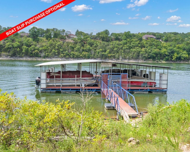 dock area featuring a wooded view, a water view, and boat lift