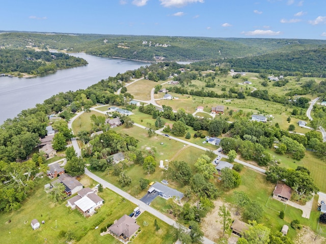 drone / aerial view with a residential view and a water view