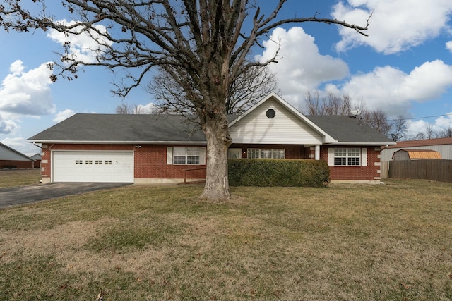 ranch-style house featuring an attached garage, brick siding, fence, driveway, and a front lawn