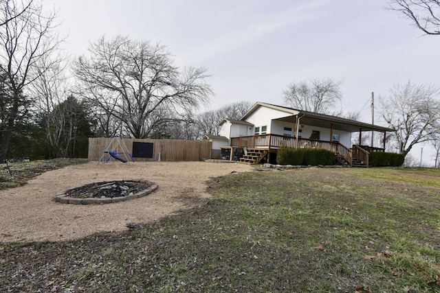 view of yard featuring stairs and a wooden deck