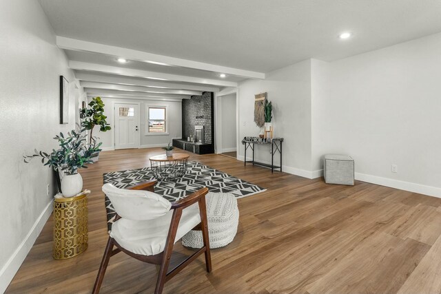 dining area featuring recessed lighting, wood finished floors, beam ceiling, and baseboards