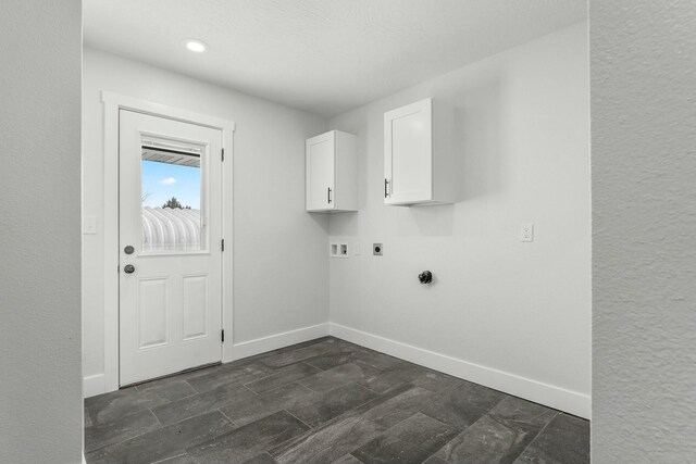 laundry room featuring hookup for a washing machine, cabinet space, baseboards, and electric dryer hookup