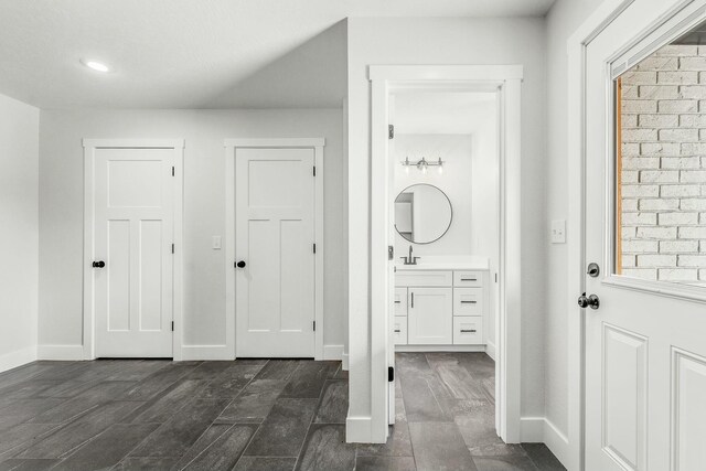 bathroom featuring vanity and baseboards