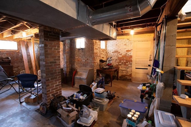 basement with brick wall