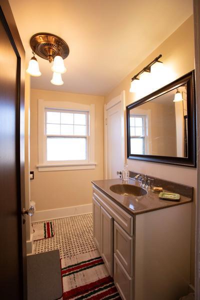 bathroom featuring tile patterned flooring, vanity, and baseboards