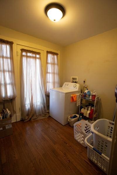 laundry room with washer / dryer, laundry area, and dark wood finished floors