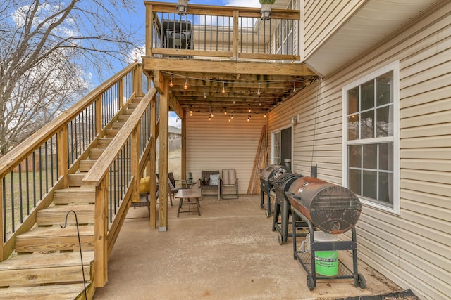 view of patio with stairway and area for grilling