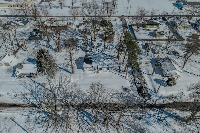 snowy aerial view with a residential view