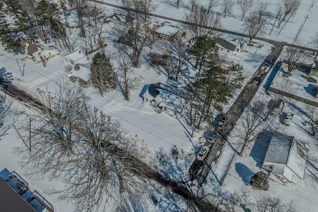 snowy aerial view with a residential view