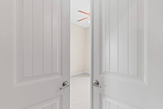 details with carpet floors and a ceiling fan