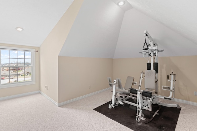 workout room featuring vaulted ceiling, carpet, and baseboards