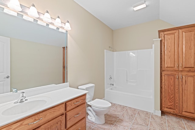 full bath with  shower combination, lofted ceiling, vanity, and toilet