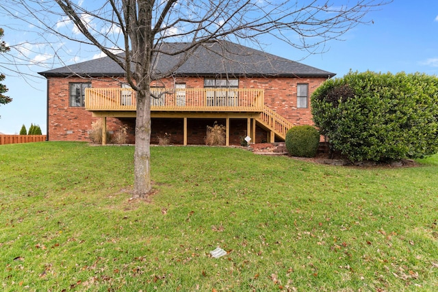 rear view of house with a deck, brick siding, crawl space, and stairs