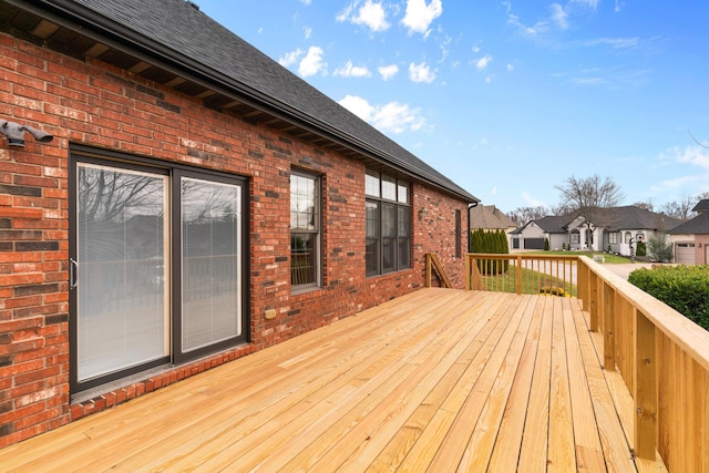 wooden terrace with a residential view