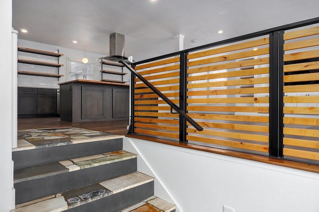 stairway featuring recessed lighting