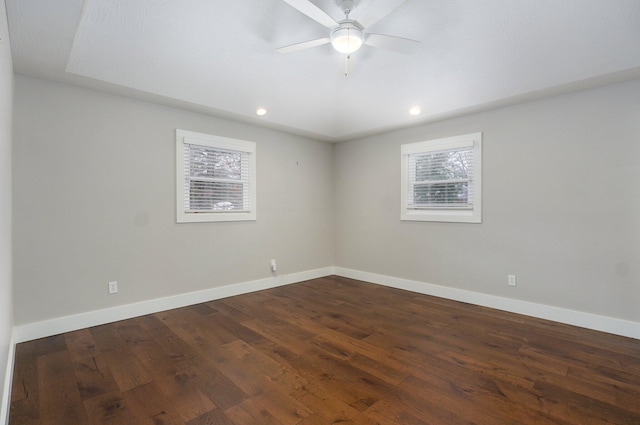 spare room with recessed lighting, dark wood-style flooring, ceiling fan, and baseboards