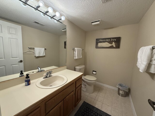 85 La Jolla Dr Unit 352-A, Lake Ozark, MO 65049 - bathroom featuring visible vents, toilet, vanity, a textured ceiling, and baseboards