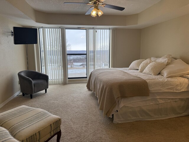 85 La Jolla Dr Unit 352-A, Lake Ozark, MO 65049 - bedroom featuring ceiling fan, baseboards, a textured ceiling, and light colored carpet