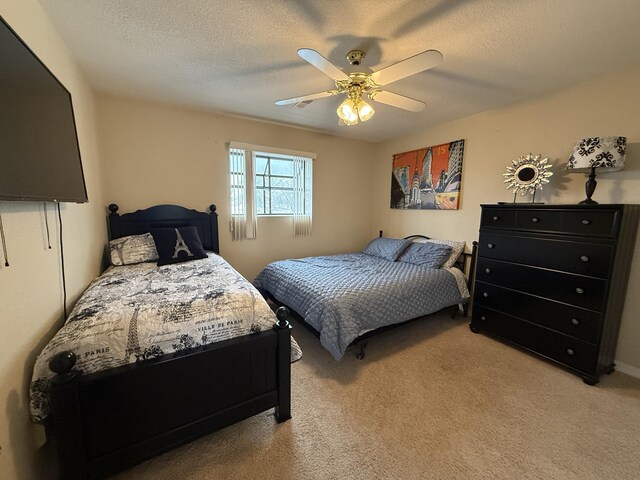 85 La Jolla Dr Unit 352-A, Lake Ozark, MO 65049 - bedroom featuring a ceiling fan, light colored carpet, and a textured ceiling