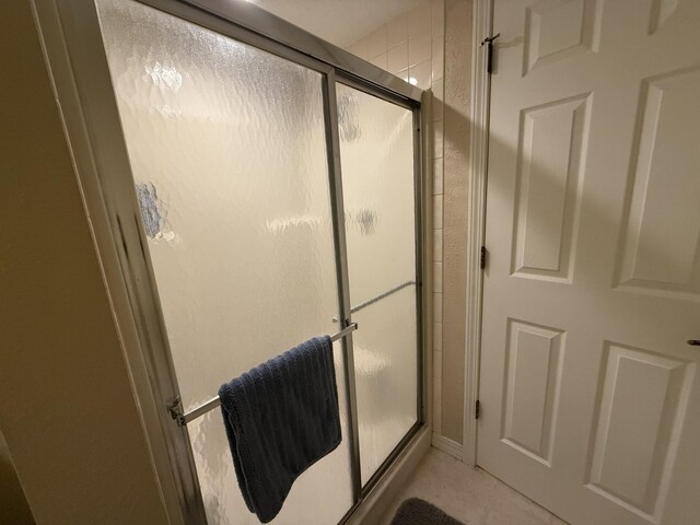 85 La Jolla Dr Unit 352-A, Lake Ozark, MO 65049 - bathroom featuring a shower stall and tile patterned floors