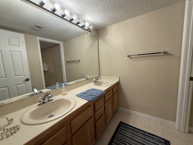 85 La Jolla Dr Unit 352-A, Lake Ozark, MO 65049 - full bathroom with visible vents, a sink, a textured ceiling, and double vanity