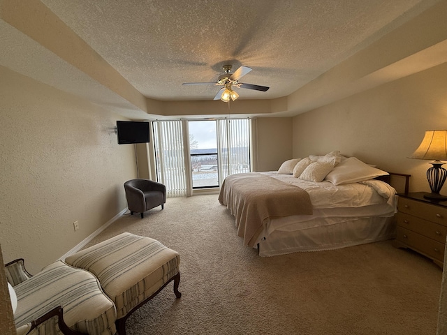 85 La Jolla Dr Unit 352-A, Lake Ozark, MO 65049 - bedroom with a textured ceiling, a ceiling fan, carpet flooring, and a textured wall