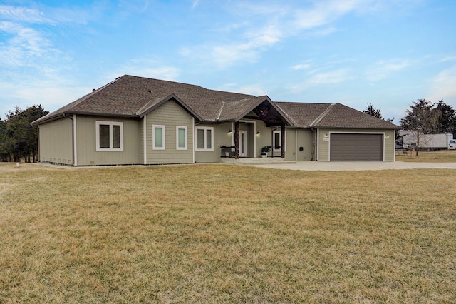 ranch-style house with an attached garage, concrete driveway, and a front yard