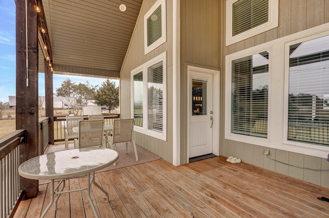 wooden deck with outdoor dining space