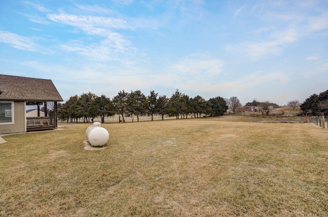 view of yard with a rural view