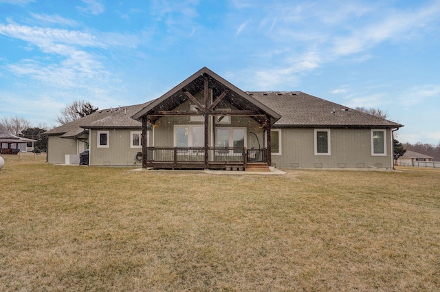 back of house featuring a deck, a yard, a shingled roof, and crawl space