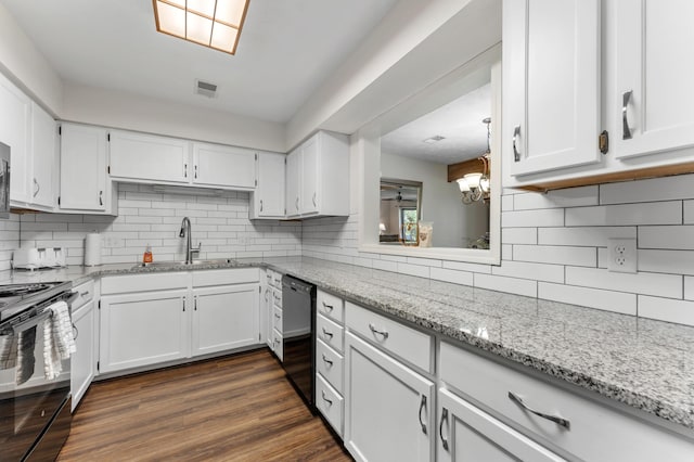 kitchen featuring dark wood-style floors, black appliances, visible vents, and white cabinets