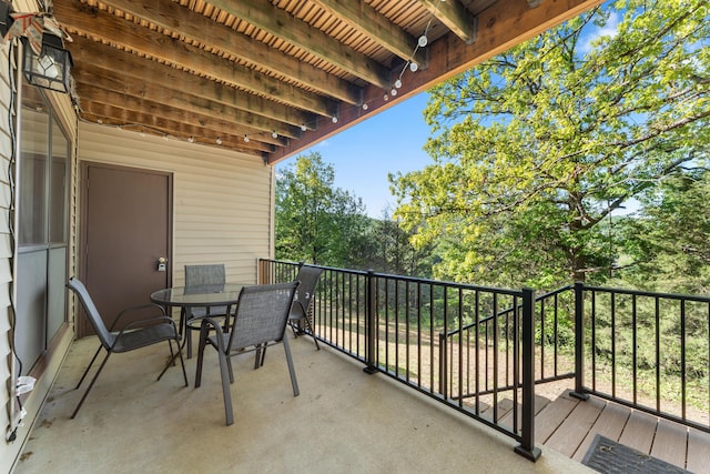 balcony with outdoor dining area