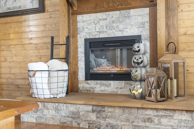 room details with a glass covered fireplace