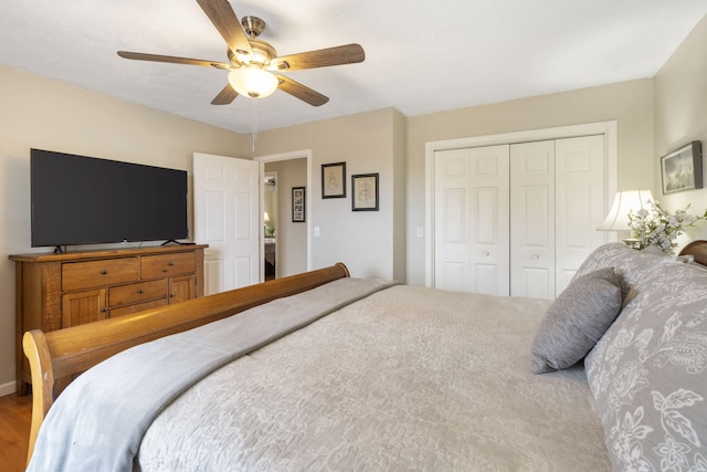 bedroom with a ceiling fan and a closet