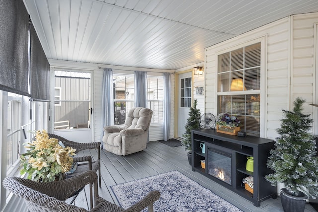 sunroom / solarium featuring wooden ceiling