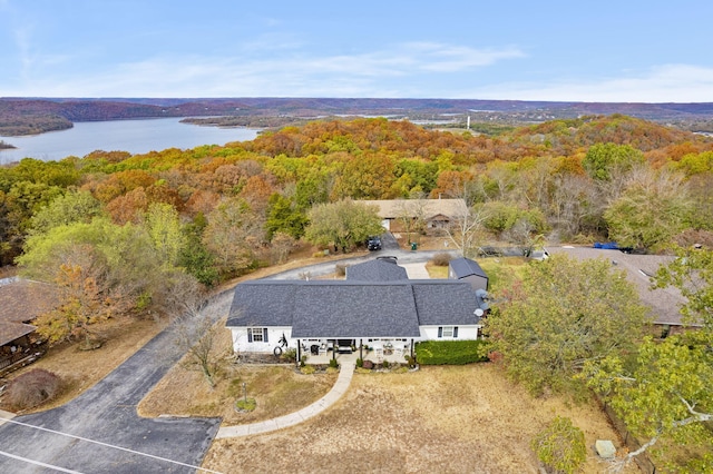 aerial view featuring a water view and a view of trees