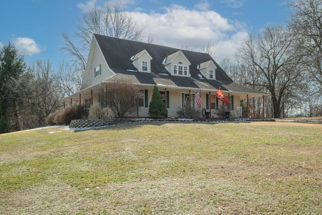 view of front of house with covered porch and a front yard