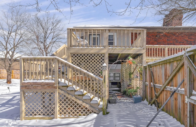 rear view of property with stairs