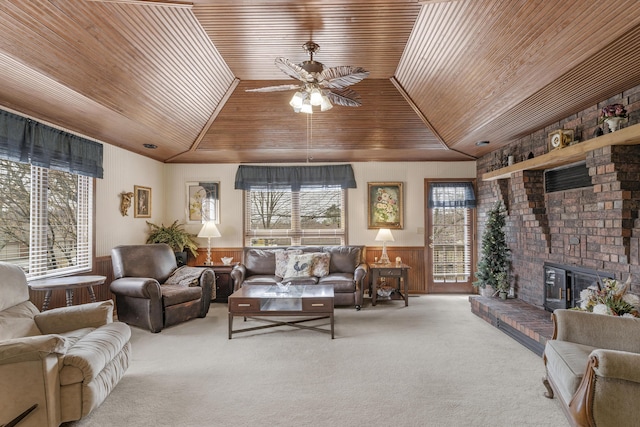 carpeted living room with a wealth of natural light, wainscoting, wood ceiling, and vaulted ceiling