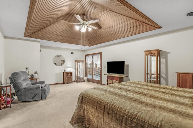 bedroom with a raised ceiling, carpet flooring, baseboards, wood ceiling, and ceiling fan