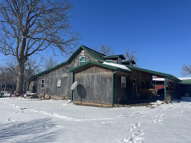 view of snowy exterior featuring crawl space