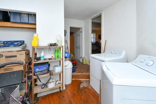 laundry area with dark wood-style floors, laundry area, and washer and dryer