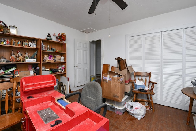 office space with dark wood-type flooring and ceiling fan