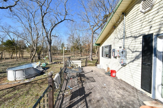 view of patio / terrace featuring an outdoor pool and a wooden deck