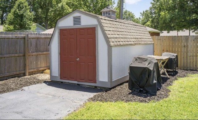 view of shed with a fenced backyard