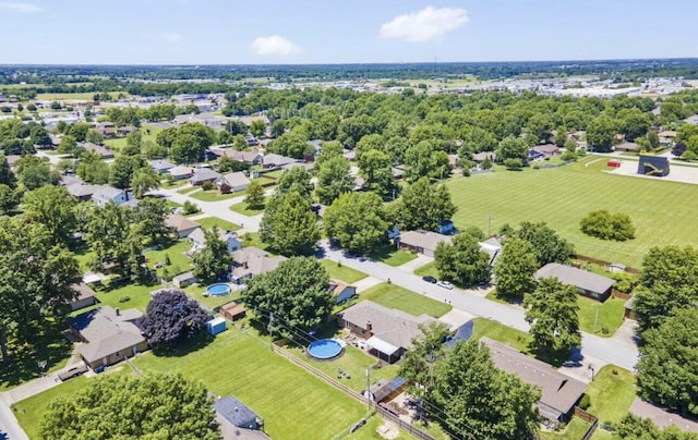 birds eye view of property with a residential view